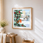 Robin and snowy church cross stitch artwork displayed on wall as home decor