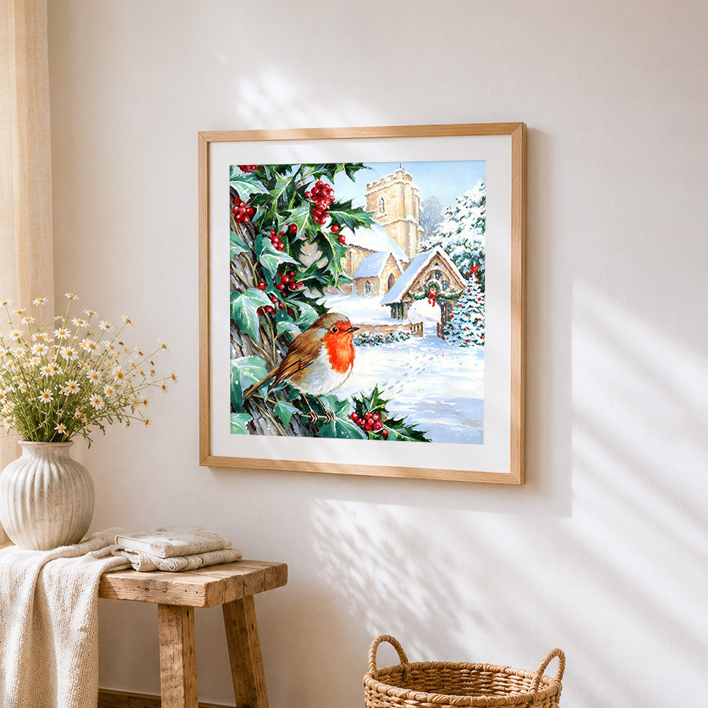 Robin and snowy church cross stitch artwork displayed on wall as home decor