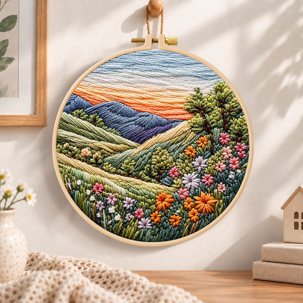 Rolling hills floral vista embroidery hoop wall art displayed as warm and cozy handmade home decor