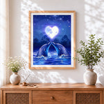 Finished romantic dolphins and heart moon cross stitch artwork displayed