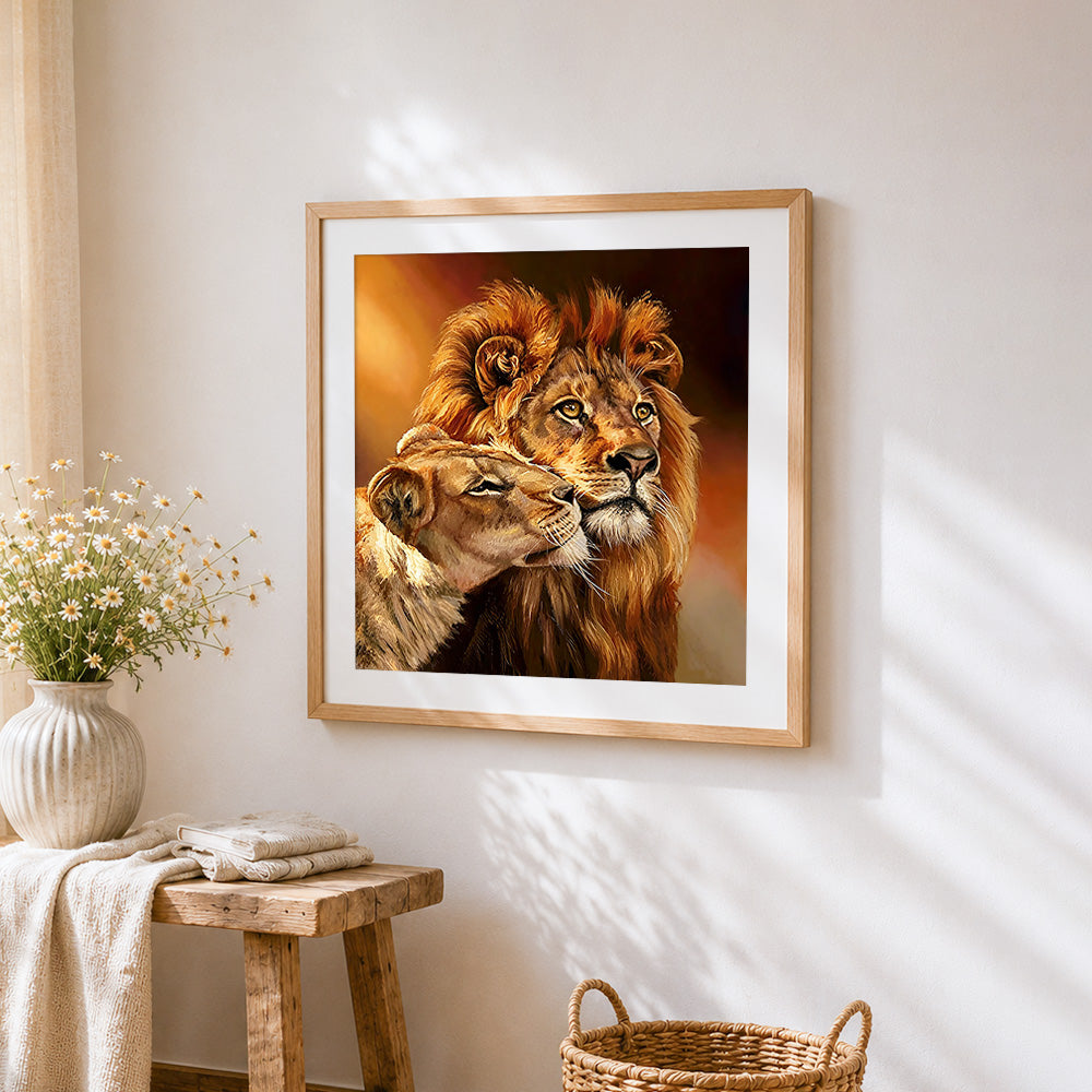 Romantic lion and lioness cross stitch artwork displayed on wall as home decor