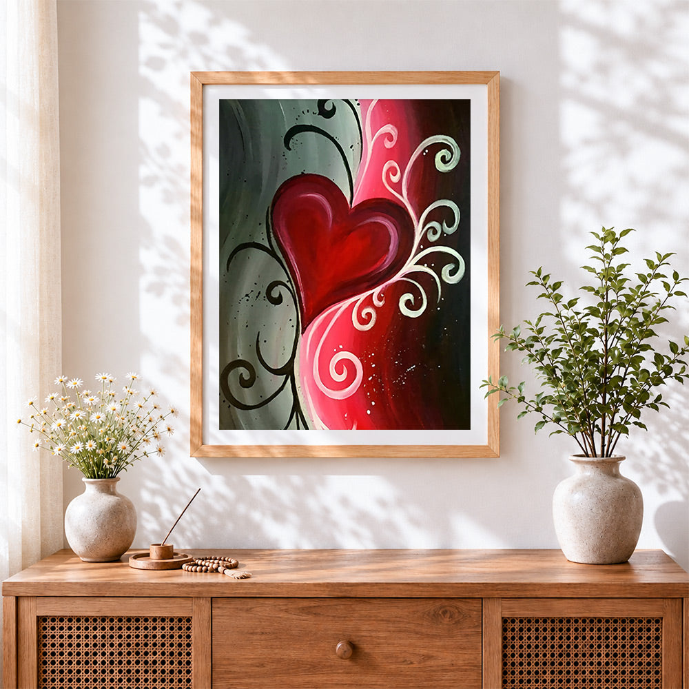 Finished romantic red heart and swirls cross stitch artwork displayed