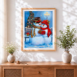 Finished romantic snowman couple cuddling by a lamppost cross stitch artwork displayed