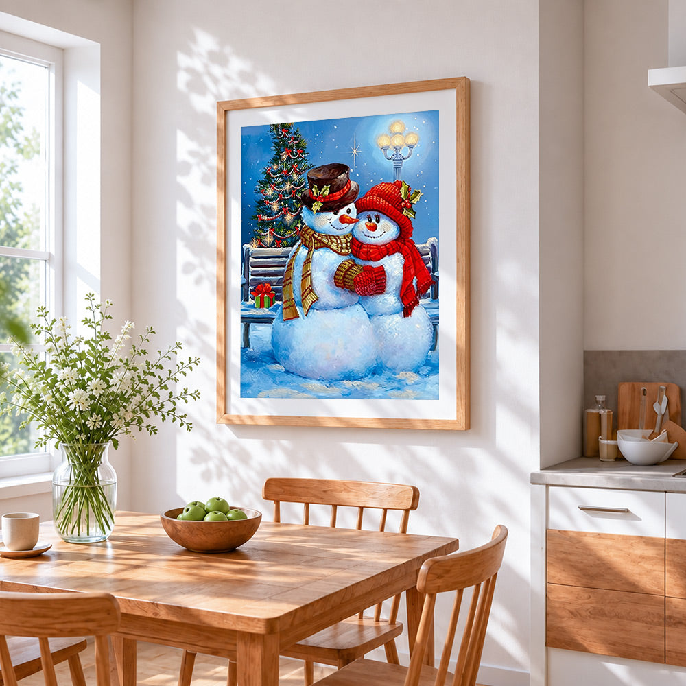 Romantic snowman couple cuddling by a lamppost cross stitch artwork displayed on wall as home decor