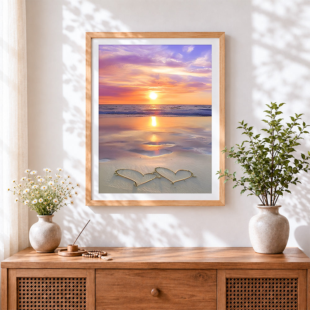 Finished romantic sunset beach cross stitch artwork displayed