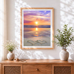 Finished romantic sunset beach cross stitch artwork displayed
