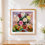 Finished roses and fruit still life cross stitch artwork displayed