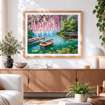Finished rowboat and ducks on a lake with blossoms cross stitch artwork displayed