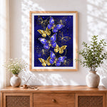 Finished royal blue and gold butterflies cross stitch artwork displayed