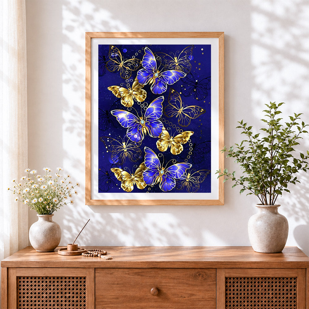 Finished royal blue and gold butterflies cross stitch artwork displayed