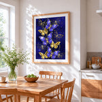 Royal blue and gold butterflies cross stitch artwork displayed on wall as home decor