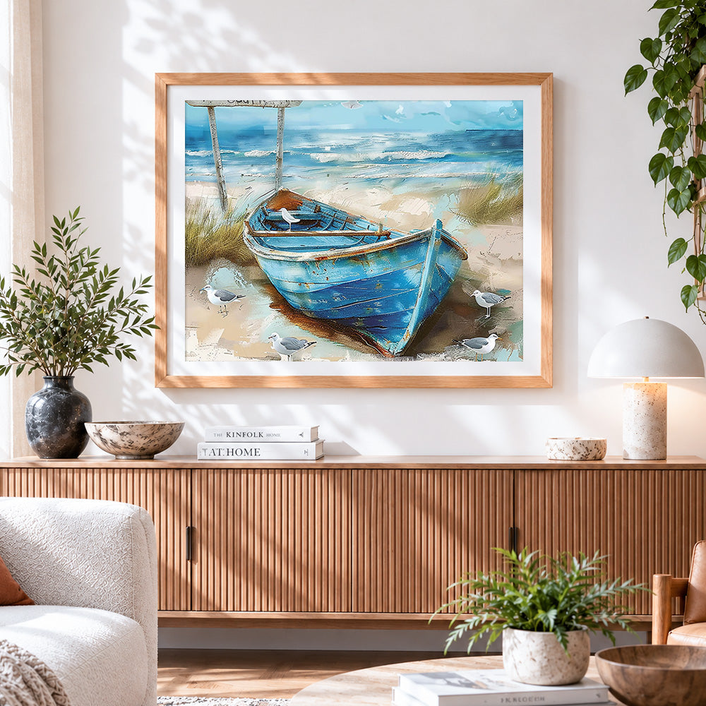 Finished rustic blue boat on beach cross stitch artwork displayed