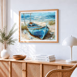 Rustic blue boat on beach cross stitch artwork displayed on wall as home decor