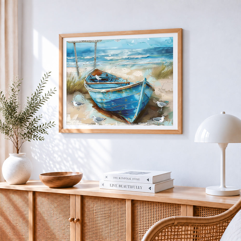 Rustic blue boat on beach cross stitch artwork displayed on wall as home decor