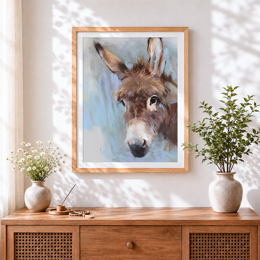 Finished rustic donkey cross stitch artwork displayed