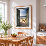 Rustic doors to sandy beach cross stitch artwork displayed on wall as home decor