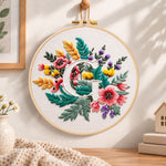 Rustic floral mix and letter g embroidery hoop wall art displayed as warm and cosy handmade home decor
