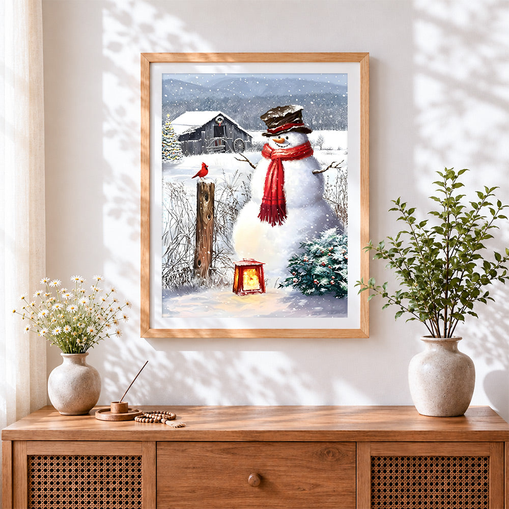 Finished rustic snowman and red cardinal on a farm cross stitch artwork displayed