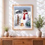 Finished rustic snowman and red cardinal on a farm cross stitch artwork displayed
