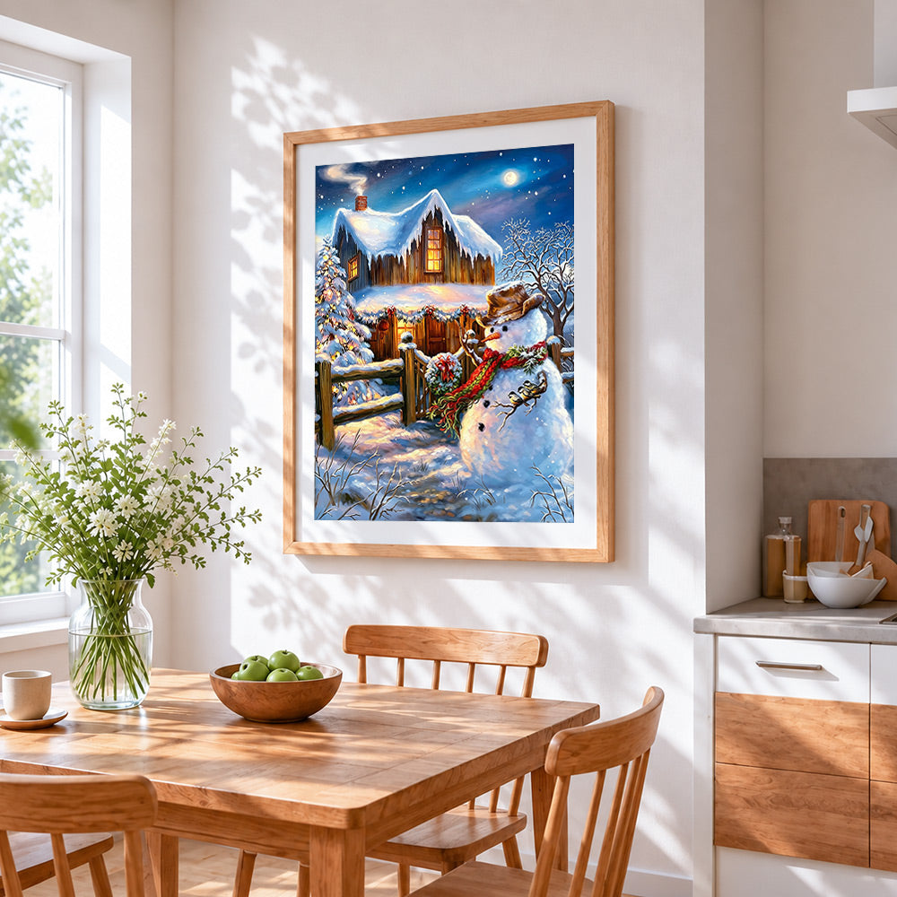 Rustic snowman by a cosy log cabin cross stitch artwork displayed on wall as home decor