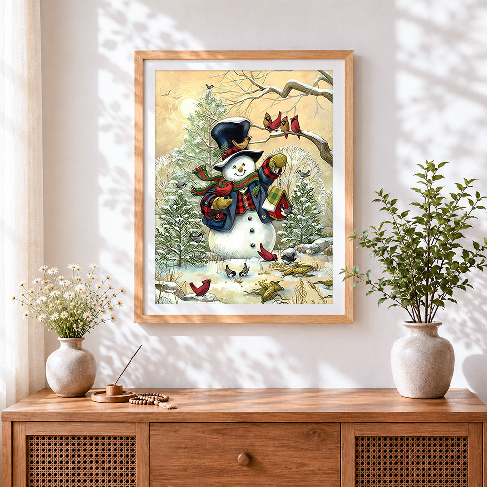 Finished rustic snowman feeding winter birds cross stitch artwork displayed