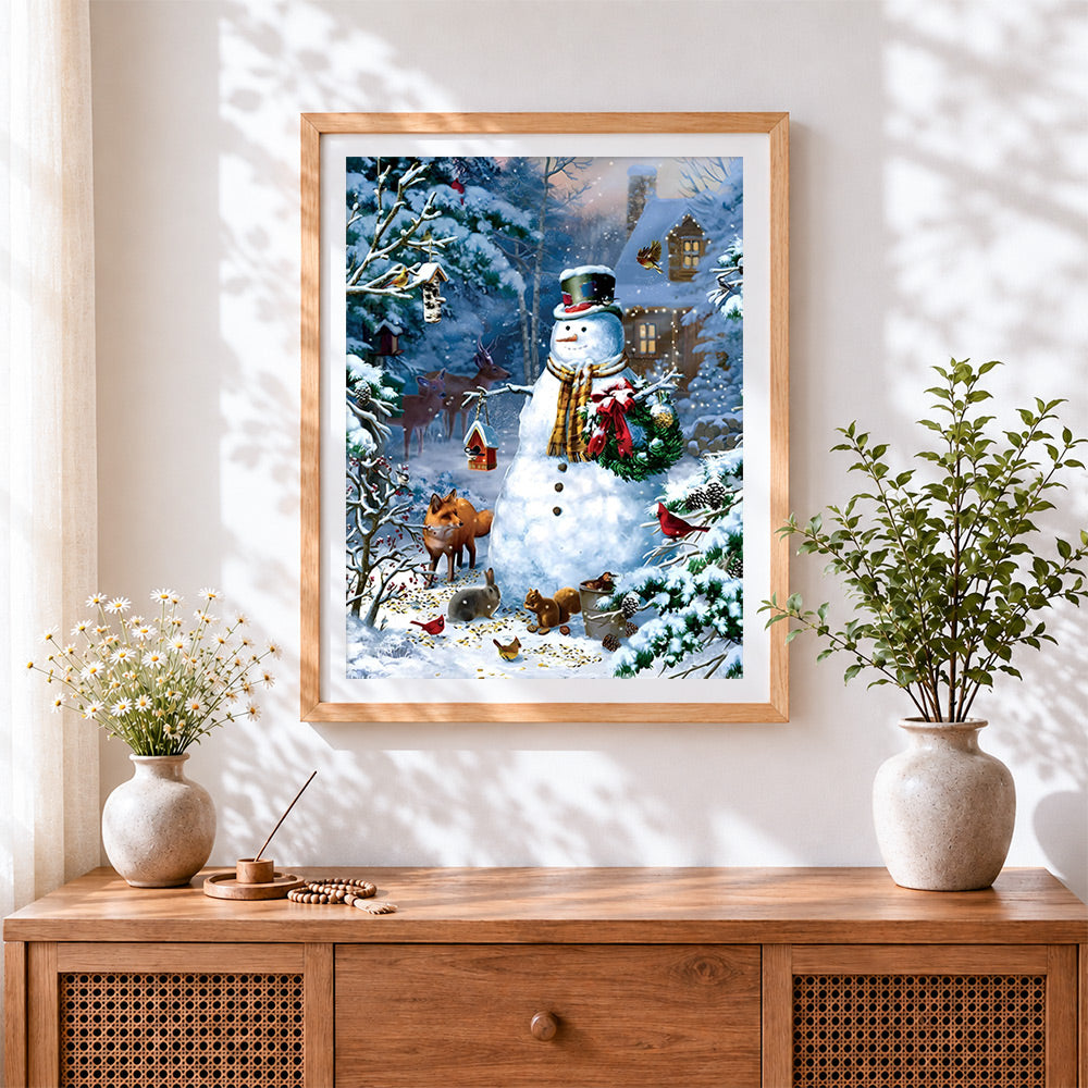 Finished rustic snowman feeding woodland animals cross stitch artwork displayed