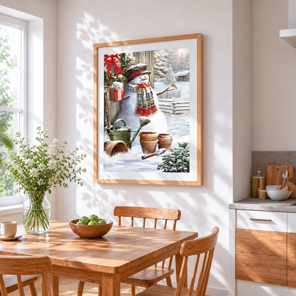 Rustic snowman, robin and gardening tools cross stitch artwork displayed on wall as home decor