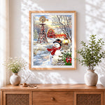 Finished rustic snowman with windmill and red barn cross stitch artwork displayed