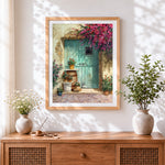 Finished rustic teal door and blossoms cross stitch artwork displayed