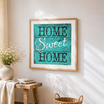 Rustic teal home sweet home wooden sign cross stitch artwork displayed on wall as home decor