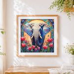 Finished sacred elephant with gold halo and tulips cross stitch artwork displayed