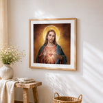 Sacred heart of jesus cross stitch artwork displayed on wall as home decor