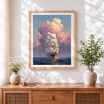Finished sailing ship in pink clouds cross stitch artwork displayed