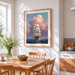 Sailing ship in pink clouds cross stitch artwork displayed on wall as home decor