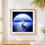 Finished sailing ship under a giant moon paint by numbers artwork displayed as home decor
