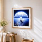 Sailing ship under a giant moon paint by numbers artwork displayed on wall as home decor