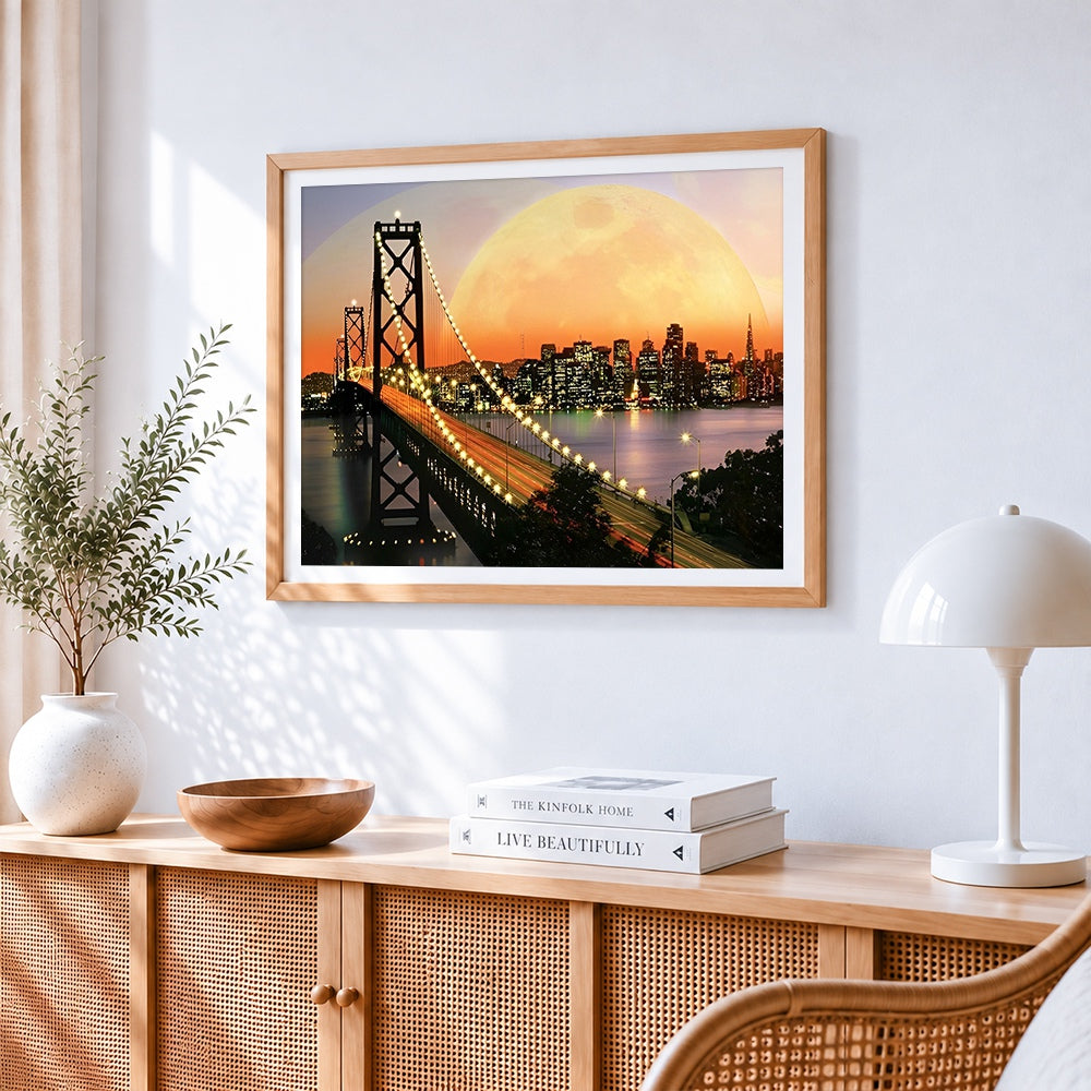 San francisco bay bridge and supermoon cross stitch artwork displayed on wall as home decor