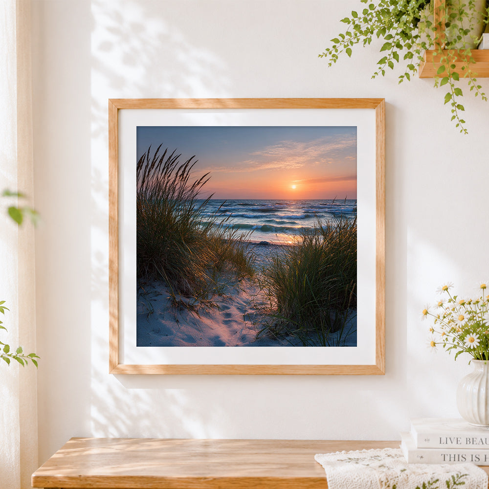 Finished sand dunes and beach grass at sunset cross stitch artwork displayed