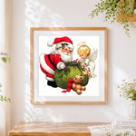 Finished santa and angel with gift sack cross stitch artwork displayed