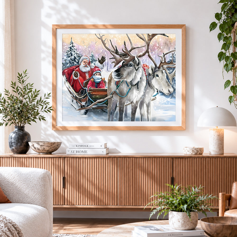 Finished santa and child in sleigh with reindeer cross stitch artwork displayed