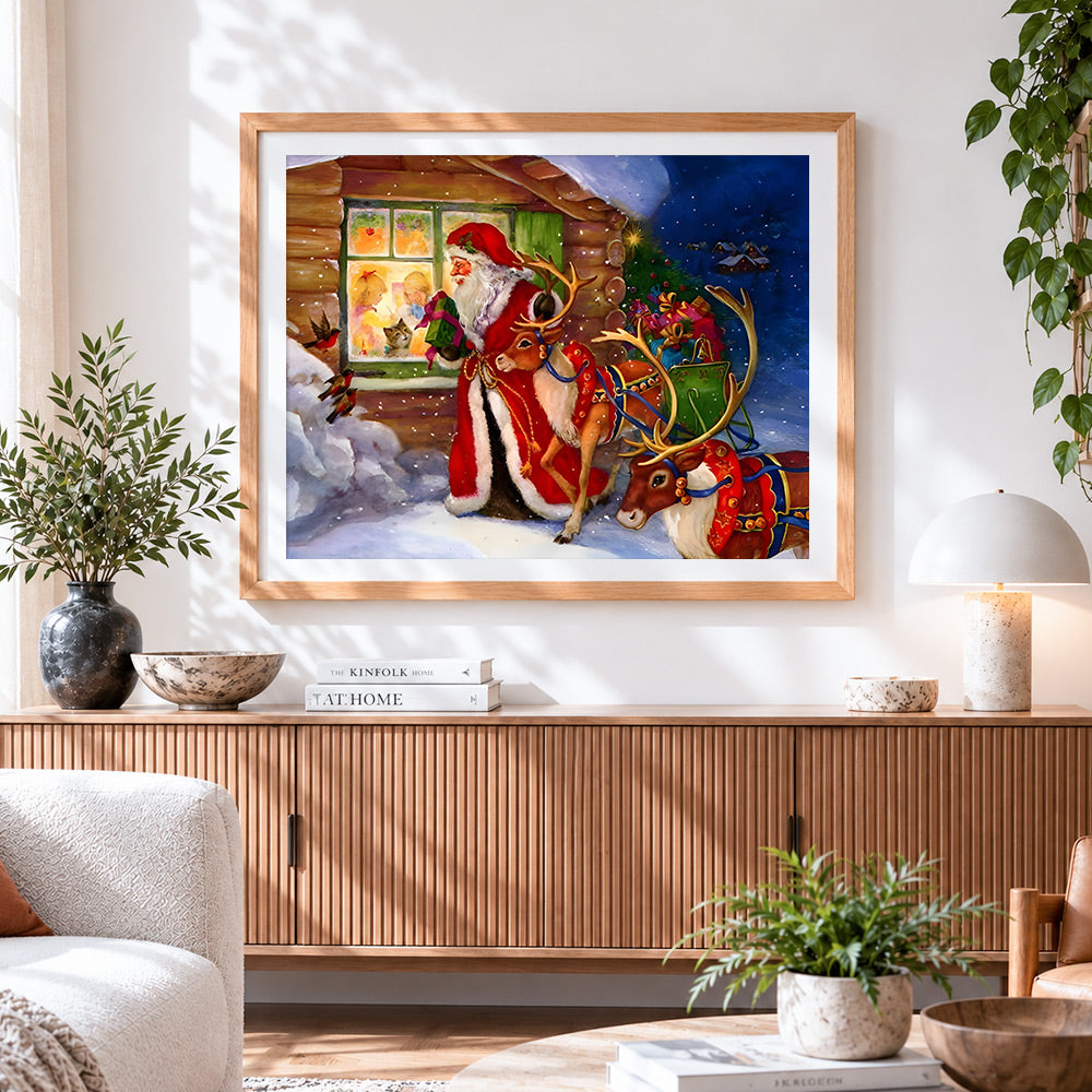 Finished santa and reindeer outside a cosy cottage cross stitch artwork displayed