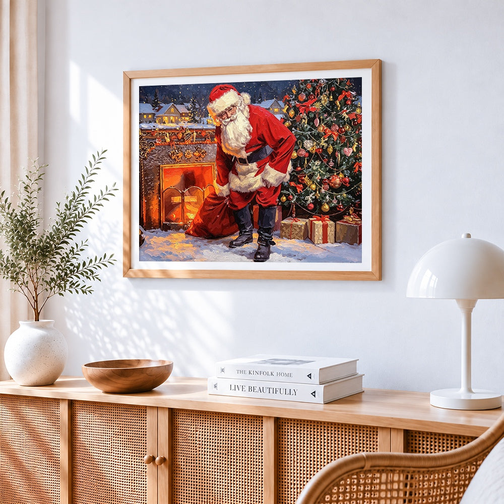 Santa by the fireplace with toy sack cross stitch artwork displayed on wall as home decor