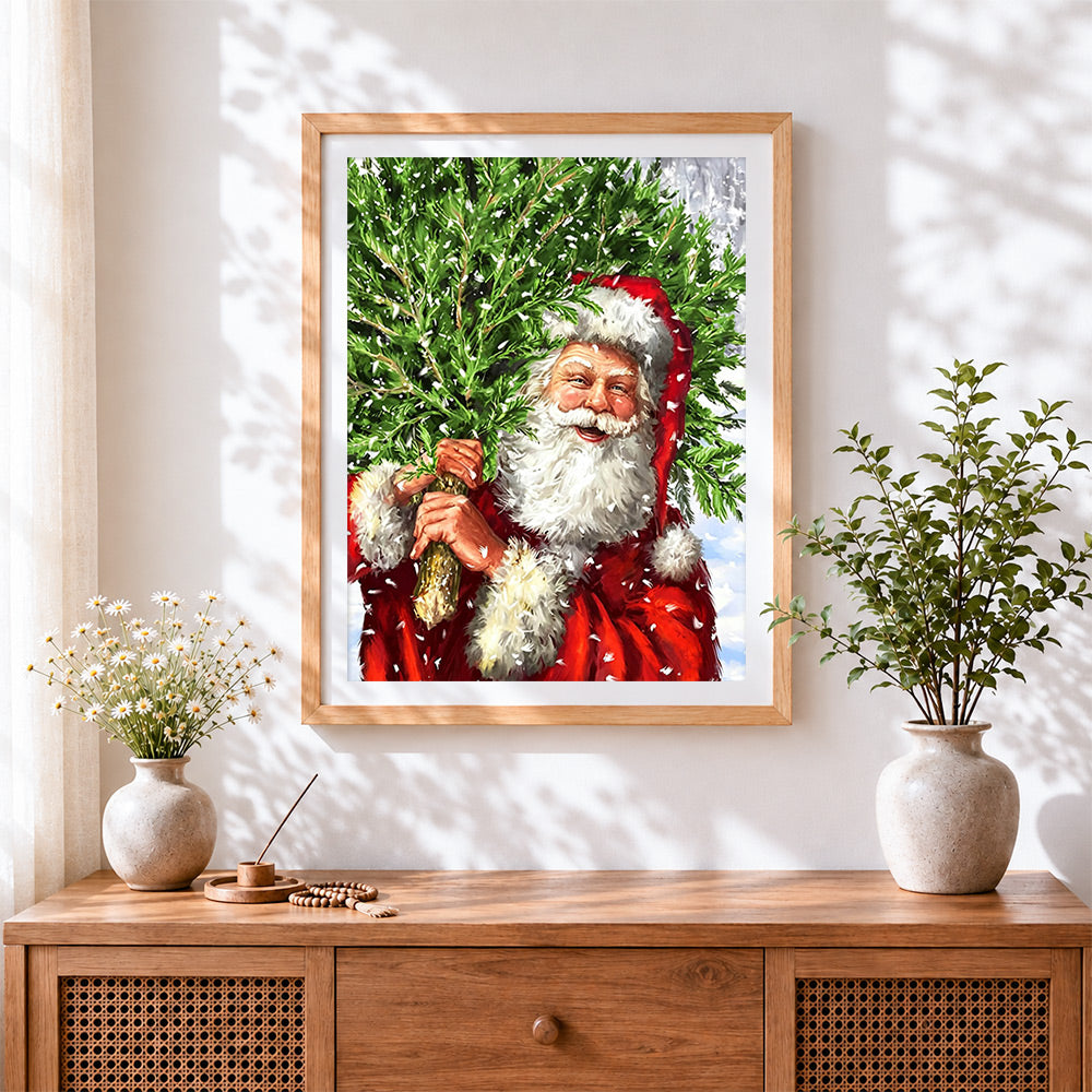 Finished santa carrying a christmas tree cross stitch artwork displayed