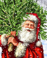 Santa carrying a christmas tree cross stitch kit for beginners