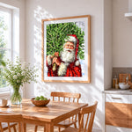 Santa carrying a christmas tree cross stitch artwork displayed on wall as home decor