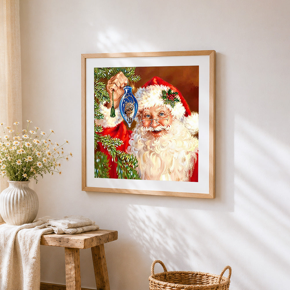 Santa claus decorating the christmas tree cross stitch artwork displayed on wall as home decor