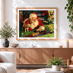 Finished santa claus playing with toy train cross stitch artwork displayed