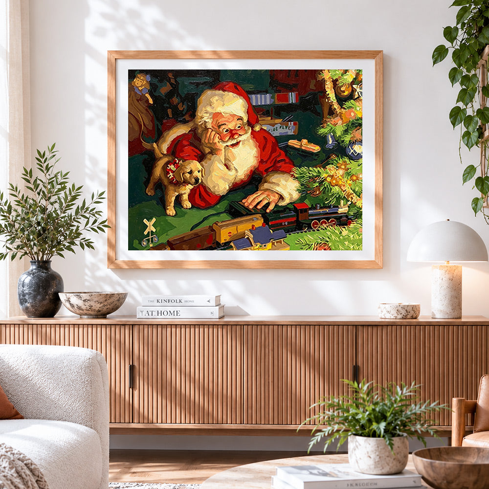 Finished santa claus playing with toy train cross stitch artwork displayed