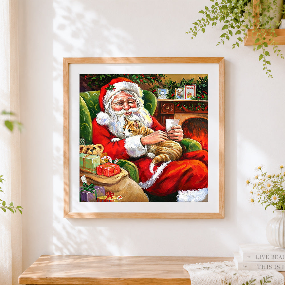 Finished santa claus reading letters with ginger cat cross stitch artwork displayed