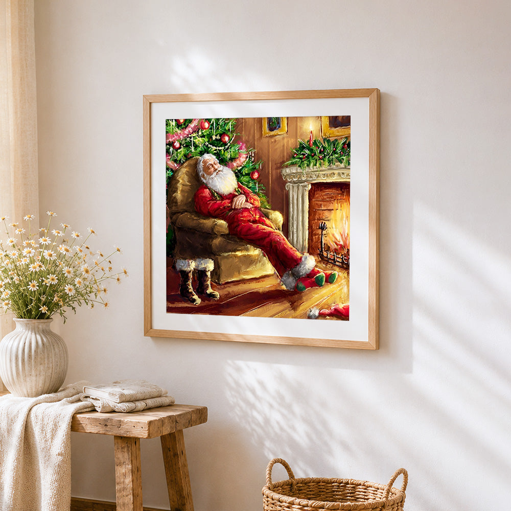 Santa claus sleeping by the fireplace cross stitch artwork displayed on wall as home decor